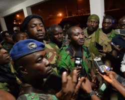Ivory Coast mutineers hold defence minister in pay standoff