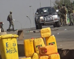 A still image from video of soldiers who have taken control of Bouake standing at a checkpoint in Bouake