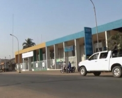 A still image from video that shows soldiers riding on a pick up truck in the empty streets of Bouake